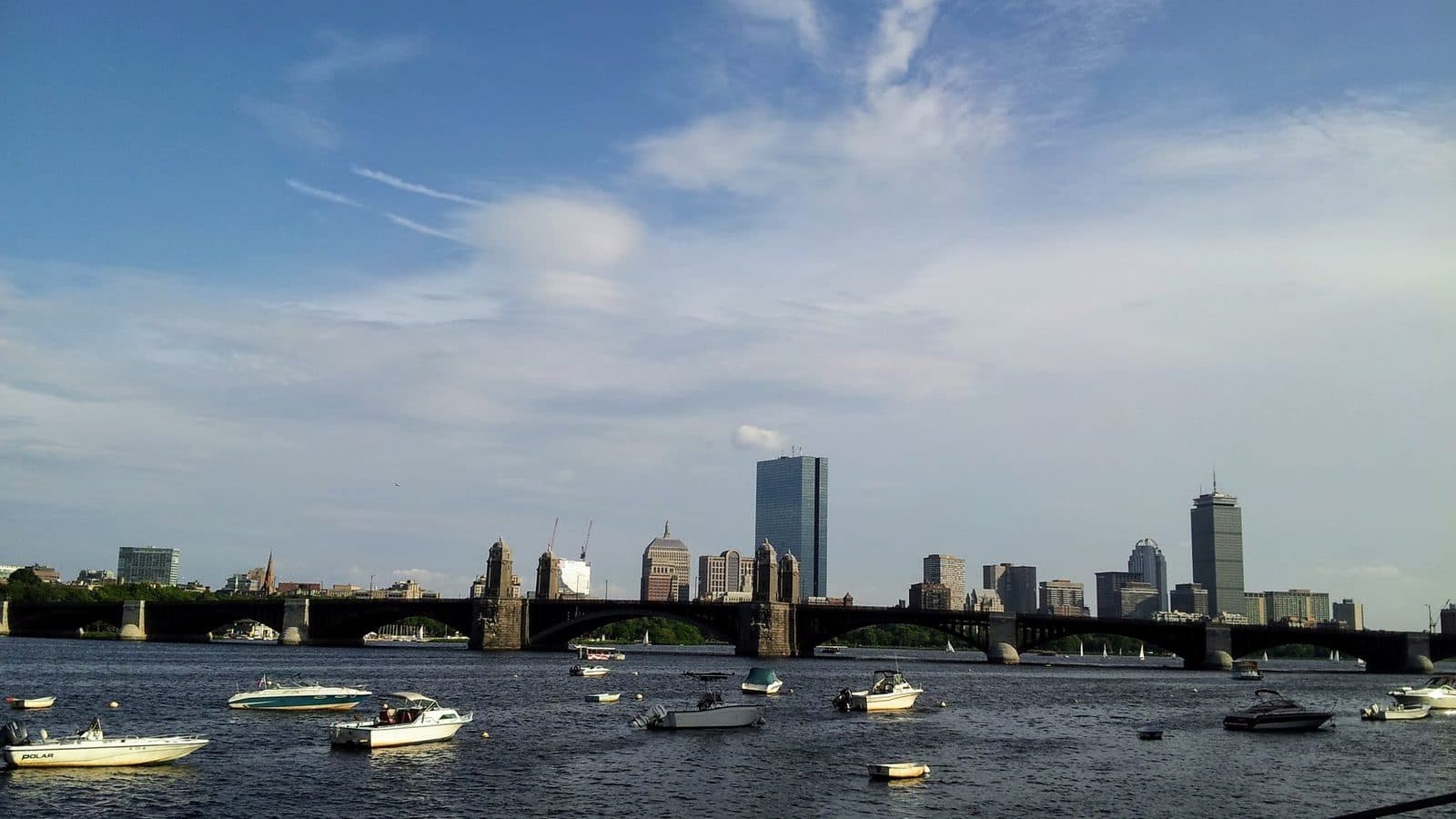 Boats on the Charles River with the Boston skyline behind